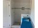 Modern bathroom featuring a tiled walk-in shower, with a niche for soaps, and granite counters at 499 Mulberry Rd, Spring Hope, NC 27882