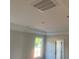 Detailed ceiling featuring crown molding and recessed lighting, paired with white trim and a glimpse of outdoors at 499 Mulberry Rd, Spring Hope, NC 27882