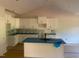 Bright open kitchen with white cabinets, granite counters, an island and modern fixtures at 499 Mulberry Rd, Spring Hope, NC 27882