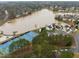 Overhead shot of community featuring lake access, tennis courts, basketball courts and playground at 5 Bobby Parker Pl, Durham, NC 27703
