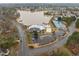 Aerial view showcasing a lakefront community center with pool, volleyball court and tennis courts at 5 Bobby Parker Pl, Durham, NC 27703