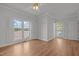 Bright bedroom with natural light, hardwood floors, and a scenic lake view at 5 Bobby Parker Pl, Durham, NC 27703