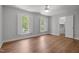 Bedroom with shuttered windows, hardwood floors and an open closet at 5 Bobby Parker Pl, Durham, NC 27703