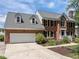 Charming two-story brick home with a two car garage, dormers, and professional landscaping at 5 Bobby Parker Pl, Durham, NC 27703