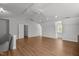 Spacious living room with hardwood floors, neutral walls, ceiling fan and large windows at 5 Bobby Parker Pl, Durham, NC 27703