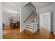 Staircase showcasing hardwood steps and white risers, leading to the upper level at 5 Bobby Parker Pl, Durham, NC 27703
