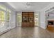Inviting sunroom with built-in shelving, and expansive windows with views at 5 Bobby Parker Pl, Durham, NC 27703