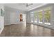 Expansive sunroom with neutral tile, natural light, and access to the backyard at 5 Bobby Parker Pl, Durham, NC 27703
