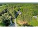 Aerial view of a home nestled among lush trees, offering privacy and a serene setting at 503 Belmont Cir, Wake Forest, NC 27587