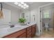 Bathroom with double sink vanity, a large mirror, and tiled floors at 503 Belmont Cir, Wake Forest, NC 27587