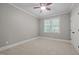 Bedroom featuring neutral carpet, ceiling fan, and bright window view at 503 Belmont Cir, Wake Forest, NC 27587