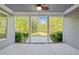 Covered patio offering a serene outdoor view of lush greenery, creating a perfect space for relaxation at 503 Belmont Cir, Wake Forest, NC 27587