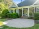 Charming exterior with a gray facade, black shutters, and a spacious concrete patio at 503 Belmont Cir, Wake Forest, NC 27587
