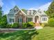 Charming two-story home with landscaped yard and a welcoming red front door, creating a picturesque curb appeal at 503 Belmont Cir, Wake Forest, NC 27587