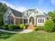 Charming two-story home with landscaped yard and a welcoming red front door, creating a picturesque curb appeal at 503 Belmont Cir, Wake Forest, NC 27587