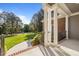 Home's front porch featuring stately columns, complemented by a lush green lawn creating a sophisticated and inviting entrance at 503 Belmont Cir, Wake Forest, NC 27587
