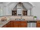 Kitchen featuring granite countertops, stainless steel appliances, and a view into the living room at 503 Belmont Cir, Wake Forest, NC 27587