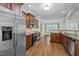 Kitchen with stainless steel appliances, granite countertops, and hardwood floors at 503 Belmont Cir, Wake Forest, NC 27587