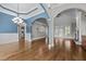 Open concept living space with hardwood floors and arched doorways at 503 Belmont Cir, Wake Forest, NC 27587