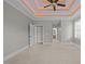 Bright main bedroom featuring decorative trey ceiling and hallway views at 503 Belmont Cir, Wake Forest, NC 27587