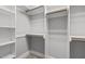 Spacious walk-in closet featuring shelves, bars, and ample storage at 503 Belmont Cir, Wake Forest, NC 27587