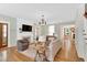 A bright living room featuring hardwood floors, a fireplace, and stylish furnishings in a cozy setting at 506 S King Ave, Dunn, NC 28334