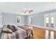Spacious primary bedroom with wood floors, ceiling fan, and ample natural light at 506 S King Ave, Dunn, NC 28334