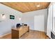 Bright home office space featuring wood floors, shiplap, and natural light at 506 S King Ave, Dunn, NC 28334