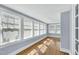 Bright sunroom with hardwood floors and multiple windows letting in lots of natural light at 506 S King Ave, Dunn, NC 28334