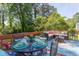 Cozy backyard deck featuring a dining set and seating with views of serene greenery at 508 E Trinity Ave, Durham, NC 27701