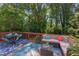 Inviting back deck featuring outdoor seating, dining area, and lush greenery at 508 E Trinity Ave, Durham, NC 27701