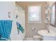 Bright bathroom with sink, patterned shower curtain, and neutral colors at 508 E Trinity Ave, Durham, NC 27701
