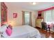 Charming bedroom featuring colorful accents, hardwood floors, and plenty of light at 508 E Trinity Ave, Durham, NC 27701