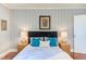 Bedroom highlighting a well-appointed bed with a black headboard and stylish bedside tables at 508 E Trinity Ave, Durham, NC 27701