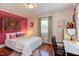 Comfortable bedroom featuring a bed, window, decor, and a workspace with a desk at 508 E Trinity Ave, Durham, NC 27701