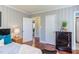 Bedroom showcasing doorways, closet doors and a sleek, dark dresser with decor at 508 E Trinity Ave, Durham, NC 27701