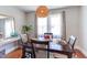 A naturally lit dining room with wood floors and table setting at 508 E Trinity Ave, Durham, NC 27701