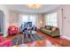 Bright, modern living room featuring hardwood floors, stylish furniture, a decorative rug, and natural light at 508 E Trinity Ave, Durham, NC 27701