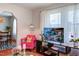 Bright living room featuring modern furniture, decorative area rug, and access to the dining area at 508 E Trinity Ave, Durham, NC 27701