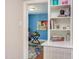 Charming office space with built-in shelving and view into a colorful room at 508 E Trinity Ave, Durham, NC 27701