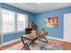 Bright office with a large window, modern desk, and colorful area rug at 508 E Trinity Ave, Durham, NC 27701