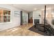 Basement with access to backyard, fireplace, and gym equipment at 5420 Vista View Ct, Raleigh, NC 27612