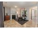 Finished basement area with gym equipment, fireplace, and tile flooring at 5420 Vista View Ct, Raleigh, NC 27612