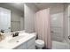 Compact bathroom featuring a shower-tub combo and a white vanity at 5420 Vista View Ct, Raleigh, NC 27612