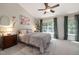 Serene bedroom with vaulted ceilings, ample natural light, and stylish furnishings at 5420 Vista View Ct, Raleigh, NC 27612