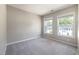 Neutral bedroom with two windows and neutral carpet at 5420 Vista View Ct, Raleigh, NC 27612