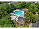 Aerial view of community pool with lounge chairs, picnic tables, and playground at 5420 Vista View Ct, Raleigh, NC 27612