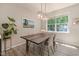 Inviting dining room with modern lighting, a wooden table, and serene decor at 5420 Vista View Ct, Raleigh, NC 27612