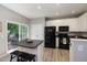 Modern kitchen with stainless steel appliances, an island, and plenty of cabinet space at 5420 Vista View Ct, Raleigh, NC 27612