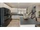 Bright kitchen featuring white cabinets, a center island, and modern appliances at 5420 Vista View Ct, Raleigh, NC 27612